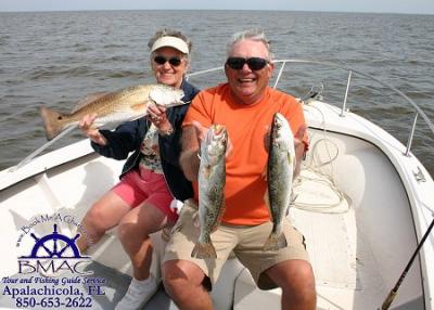 Patty & Rolland w 24 in redfish and gator trout